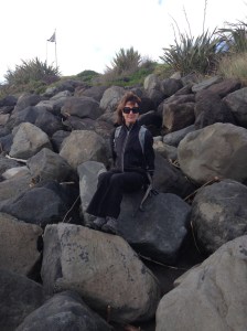 Scenes from the Coastal Walkway -- Beth on the big rocks along the black sand beach