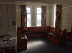 The sitting room of the public women's restroom in one of the square's downtown.  It also has a fireplace!