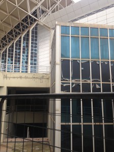 The outside of another building with its peeling facade. This building was closed up, so we aren't sure what it was used for.