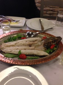 Bob's fish.  Note wine glass in background.  See dressing for fish?  Neither did we -- until the waiter cleared the plates!  🙈