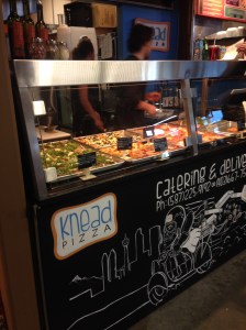 Pizza vendor serving those who "knead pizza"