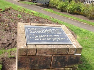 Robert Burns quote on a stone in a park across from the home where he died