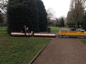 A family riding the miniature train (really!) in Grovesnor Park on Easter
