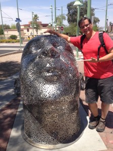 Bob standing with man's head made out of letters at last final street car stop.